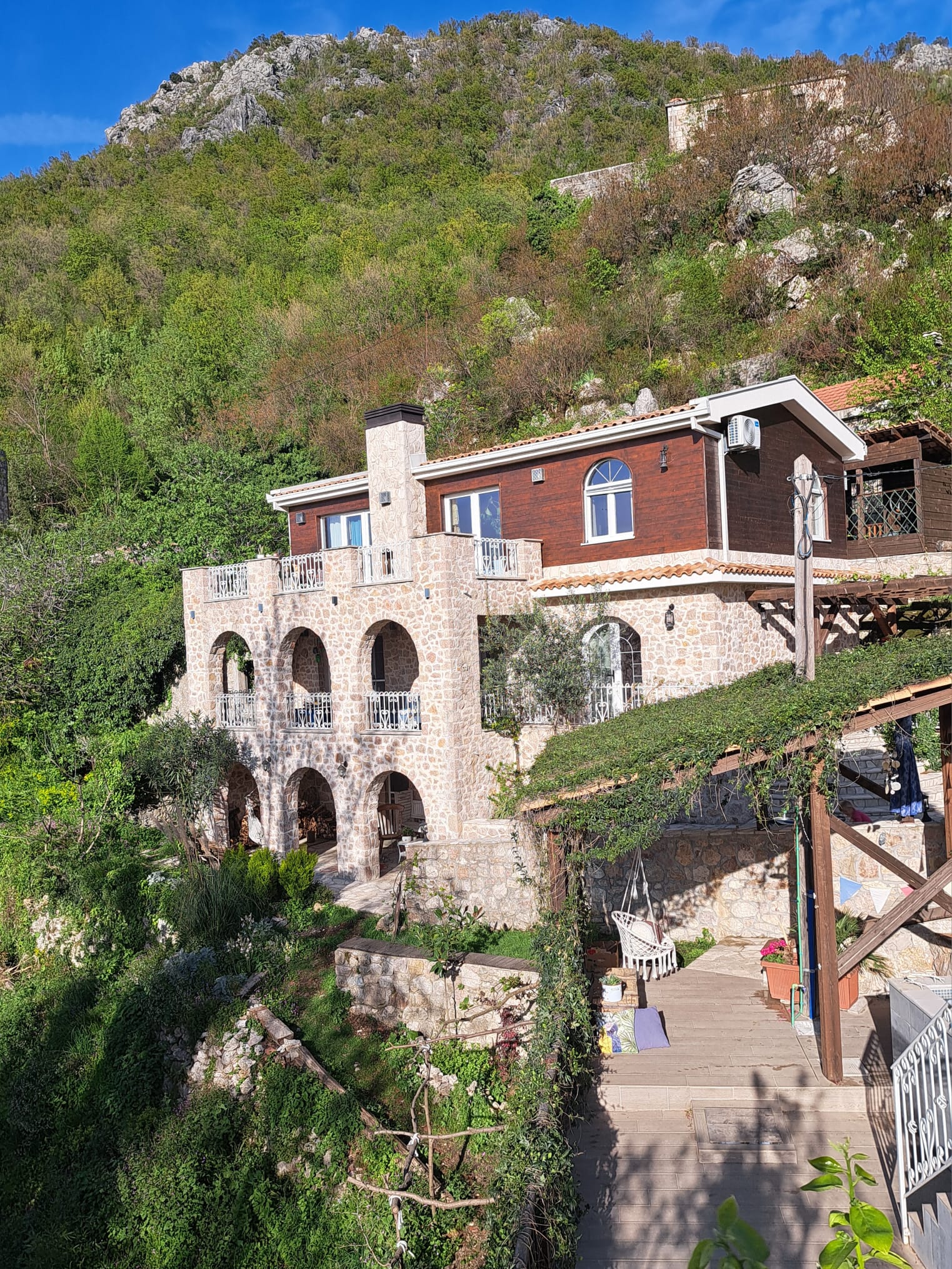 Stone house with pool surrounded by nature in a beautiful rustic village