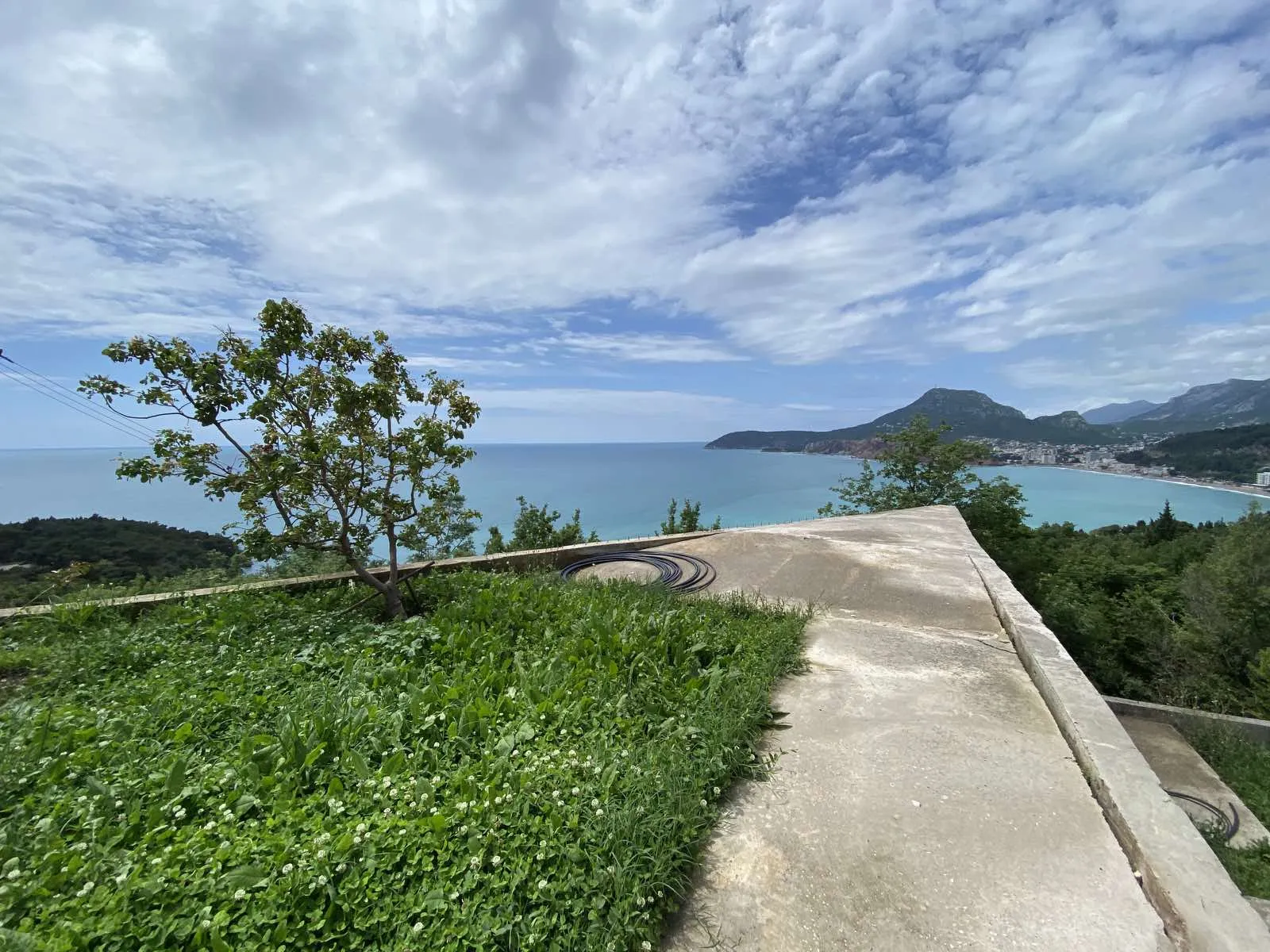 A fenced plot for sale with a panoramic view of the Adriatic Sea